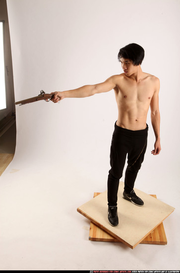 Man Young Athletic Fighting with rifle Standing poses Pants Asian