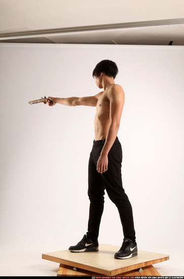 Man Young Athletic Fighting with rifle Standing poses Pants Asian