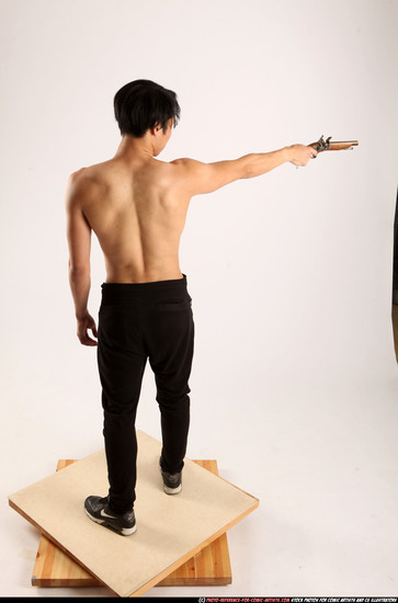 Man Young Athletic Fighting with rifle Standing poses Pants Asian