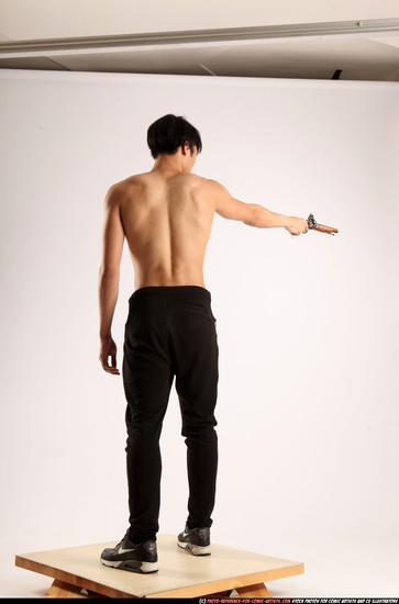 Man Young Athletic Fighting with rifle Standing poses Pants Asian