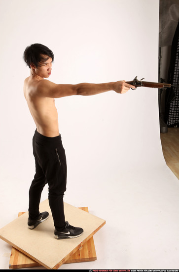 Man Young Athletic Fighting with rifle Standing poses Pants Asian