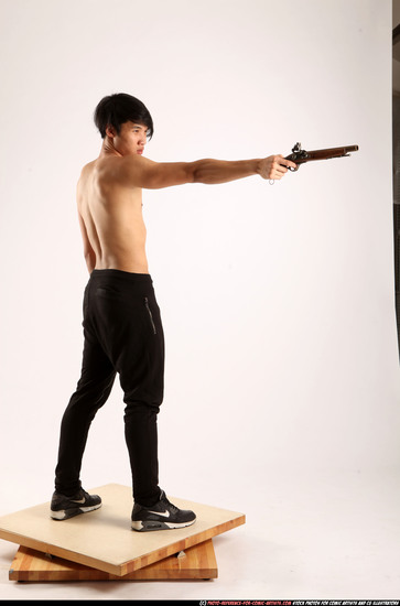 Man Young Athletic Fighting with rifle Standing poses Pants Asian