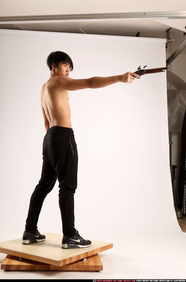 Man Young Athletic Fighting with rifle Standing poses Pants Asian