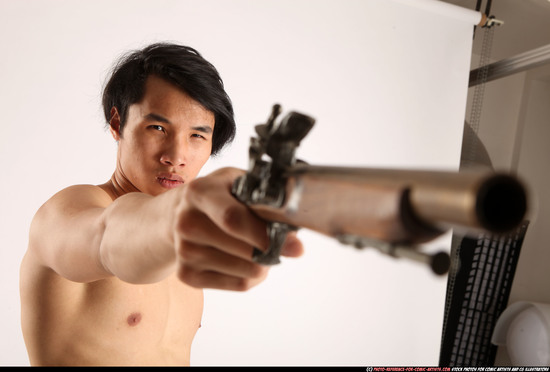 Man Young Athletic Fighting with rifle Standing poses Pants Asian