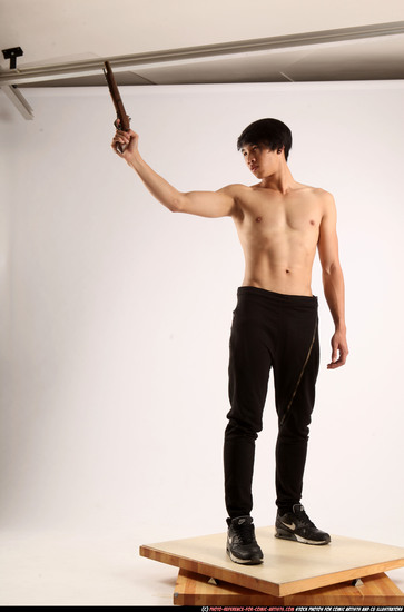 Man Young Athletic Fighting with rifle Standing poses Pants Asian