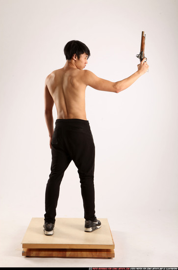 Man Young Athletic Fighting with rifle Standing poses Pants Asian