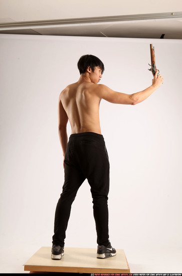 Man Young Athletic Fighting with rifle Standing poses Pants Asian