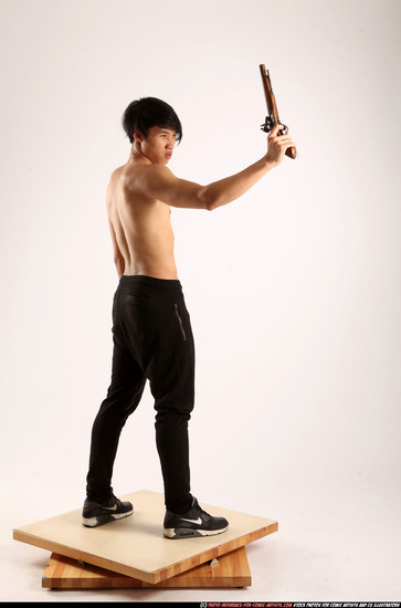 Man Young Athletic Fighting with rifle Standing poses Pants Asian