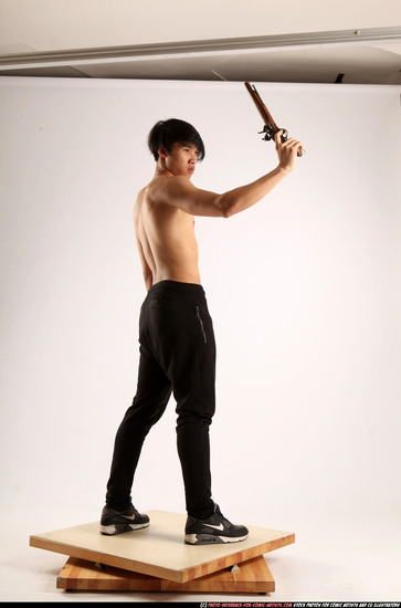 Man Young Athletic Fighting with rifle Standing poses Pants Asian