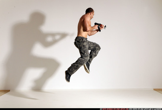 Man Adult Muscular White Fighting with submachine gun Moving poses Pants