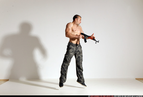 Man Adult Muscular White Fighting with submachine gun Moving poses Pants