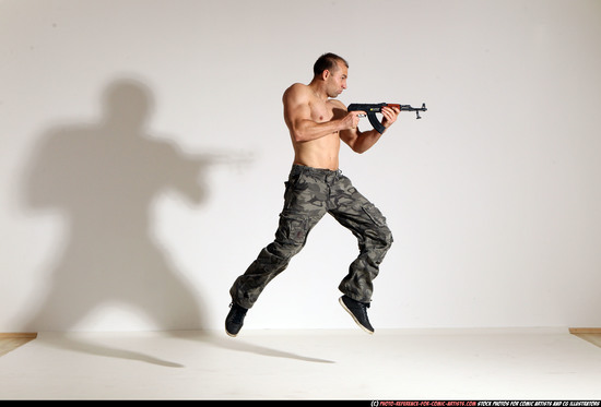 Man Adult Muscular White Fighting with submachine gun Moving poses Pants