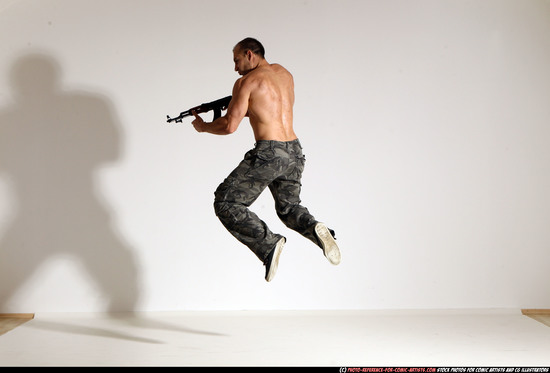 Man Adult Muscular White Fighting with submachine gun Moving poses Pants