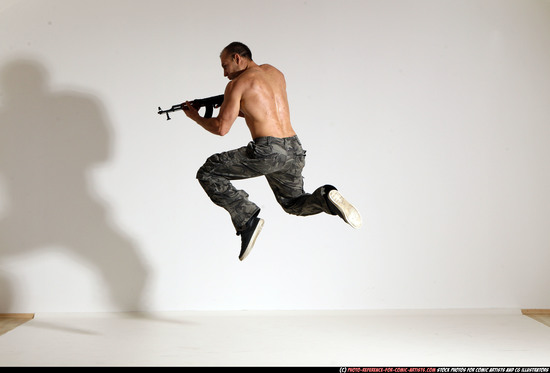 Man Adult Muscular White Fighting with submachine gun Moving poses Pants