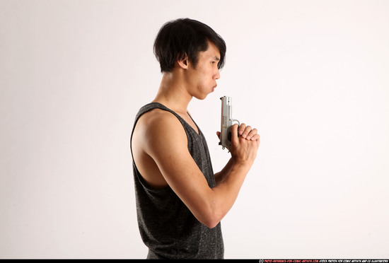 Man Young Athletic Fighting with gun Detailed photos Casual Asian