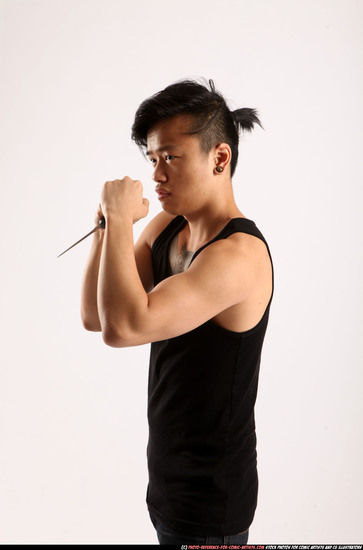 Man Young Athletic Fighting with knife Standing poses Casual Asian