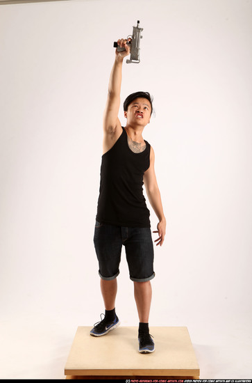 Man Young Athletic Fighting with submachine gun Standing poses Casual Asian