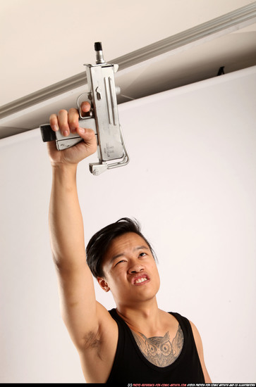 Man Young Athletic Fighting with submachine gun Standing poses Casual Asian