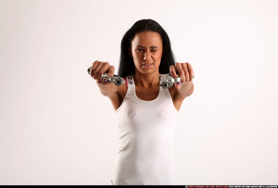 Woman Young Athletic Fighting with gun Standing poses Casual Latino