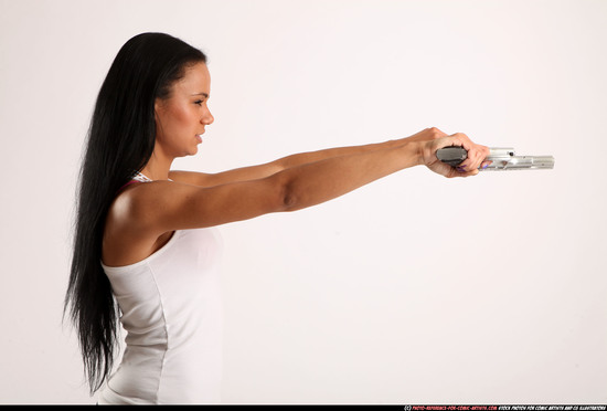 Woman Young Athletic Fighting with gun Standing poses Casual Latino