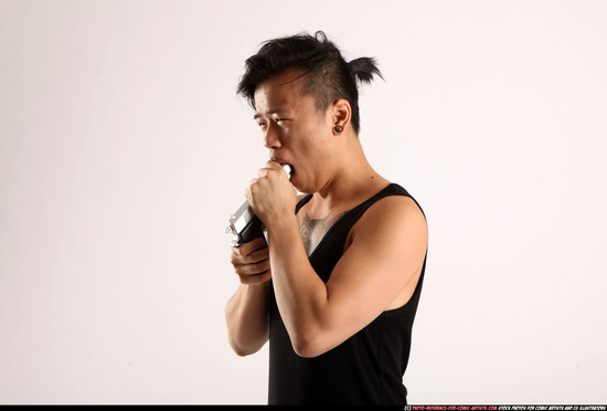 Man Young Athletic Fighting with gun Detailed photos Casual Asian