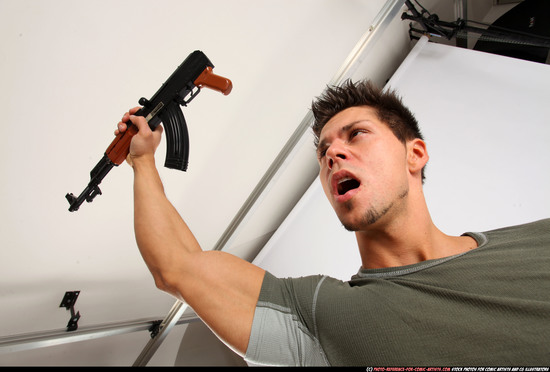 Man Adult Athletic White Fighting with submachine gun Standing poses Casual