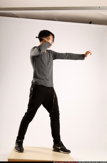 Man Young Athletic Fighting with knife Standing poses Casual Asian