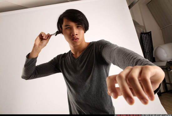 Man Young Athletic Fighting with knife Standing poses Casual Asian