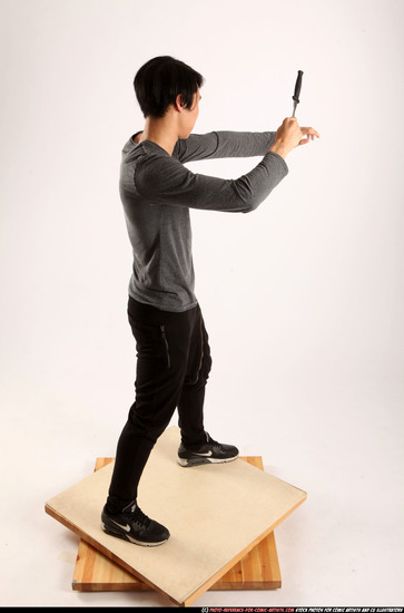 Man Young Athletic Fighting with knife Standing poses Casual Asian