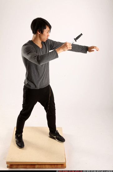 Man Young Athletic Fighting with knife Standing poses Casual Asian