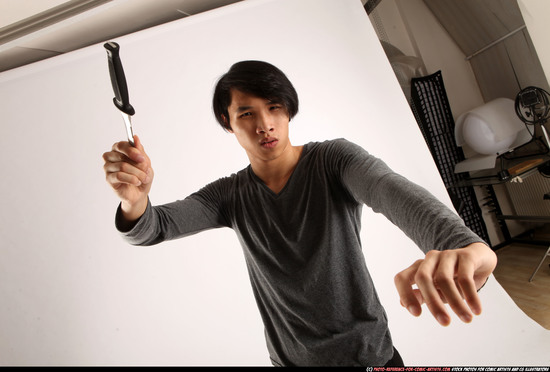 Man Young Athletic Fighting with knife Standing poses Casual Asian