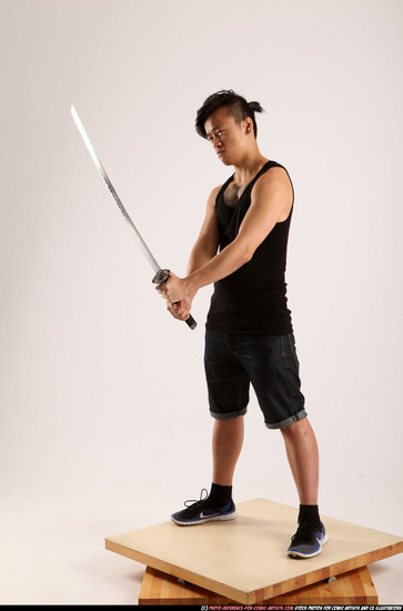 Man Young Athletic Fighting with sword Standing poses Casual Asian