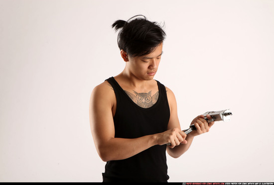 Man Young Athletic Reloading weapon Detailed photos Casual Asian