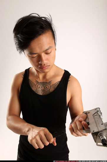 Man Young Athletic Reloading weapon Detailed photos Casual Asian