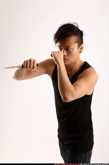 Man Young Athletic Fighting with knife Standing poses Casual Asian