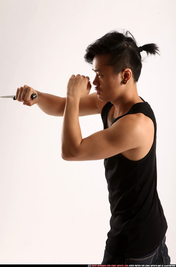 Man Young Athletic Fighting with knife Standing poses Casual Asian