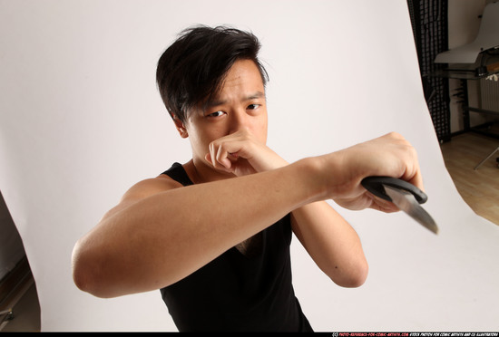 Man Young Athletic Fighting with knife Standing poses Casual Asian