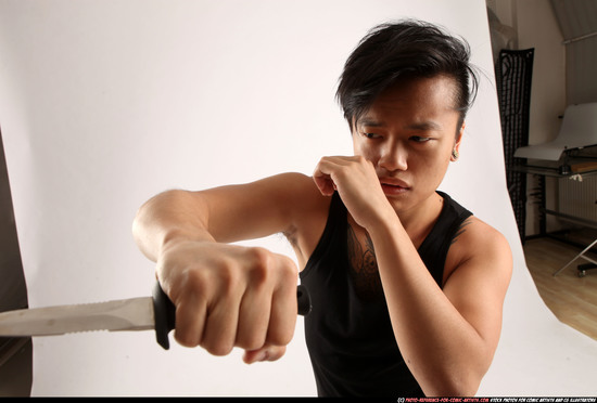 Man Young Athletic Fighting with knife Standing poses Casual Asian