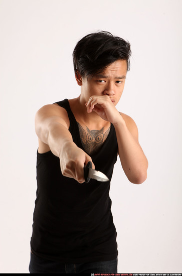 Man Young Athletic Fighting with knife Standing poses Casual Asian