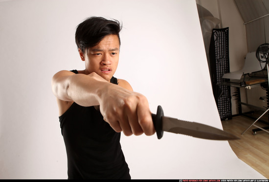 Man Young Athletic Fighting with knife Standing poses Casual Asian