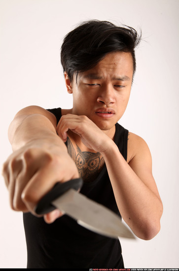 Man Young Athletic Fighting with knife Standing poses Casual Asian