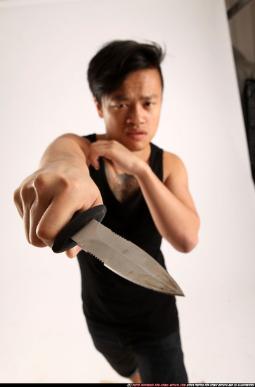 Man Young Athletic Fighting with knife Standing poses Casual Asian