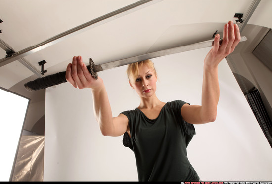 Woman Adult Athletic White Fighting with sword Standing poses Casual