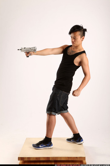 Man Young Athletic Fighting with submachine gun Standing poses Casual Asian