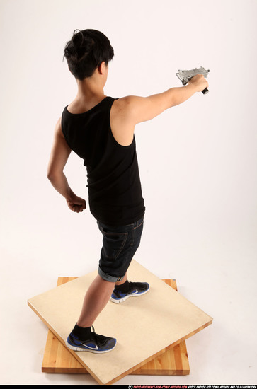 Man Young Athletic Fighting with submachine gun Standing poses Casual Asian