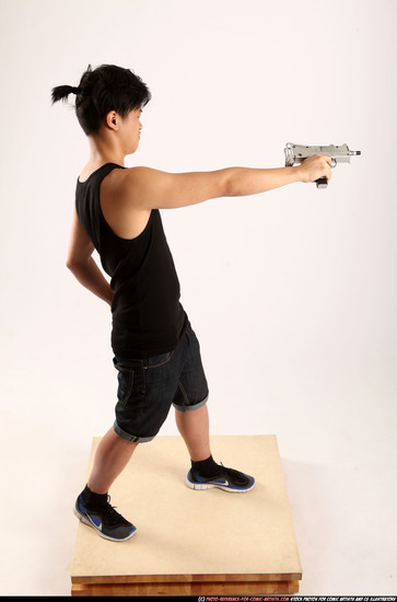 Man Young Athletic Fighting with submachine gun Standing poses Casual Asian