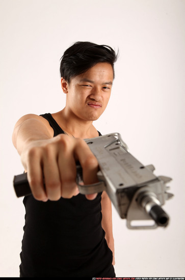 Man Young Athletic Fighting with submachine gun Standing poses Casual Asian