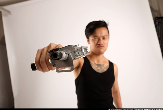 Man Young Athletic Fighting with submachine gun Standing poses Casual Asian