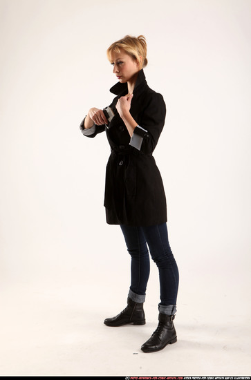 Woman Adult Athletic White Fighting with gun Standing poses Coat