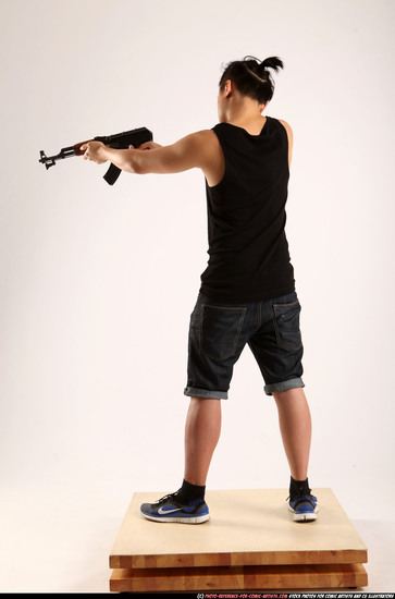 Man Young Athletic Fighting with submachine gun Standing poses Casual Asian